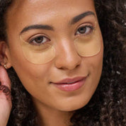 woman wearing illuminating undereye masks