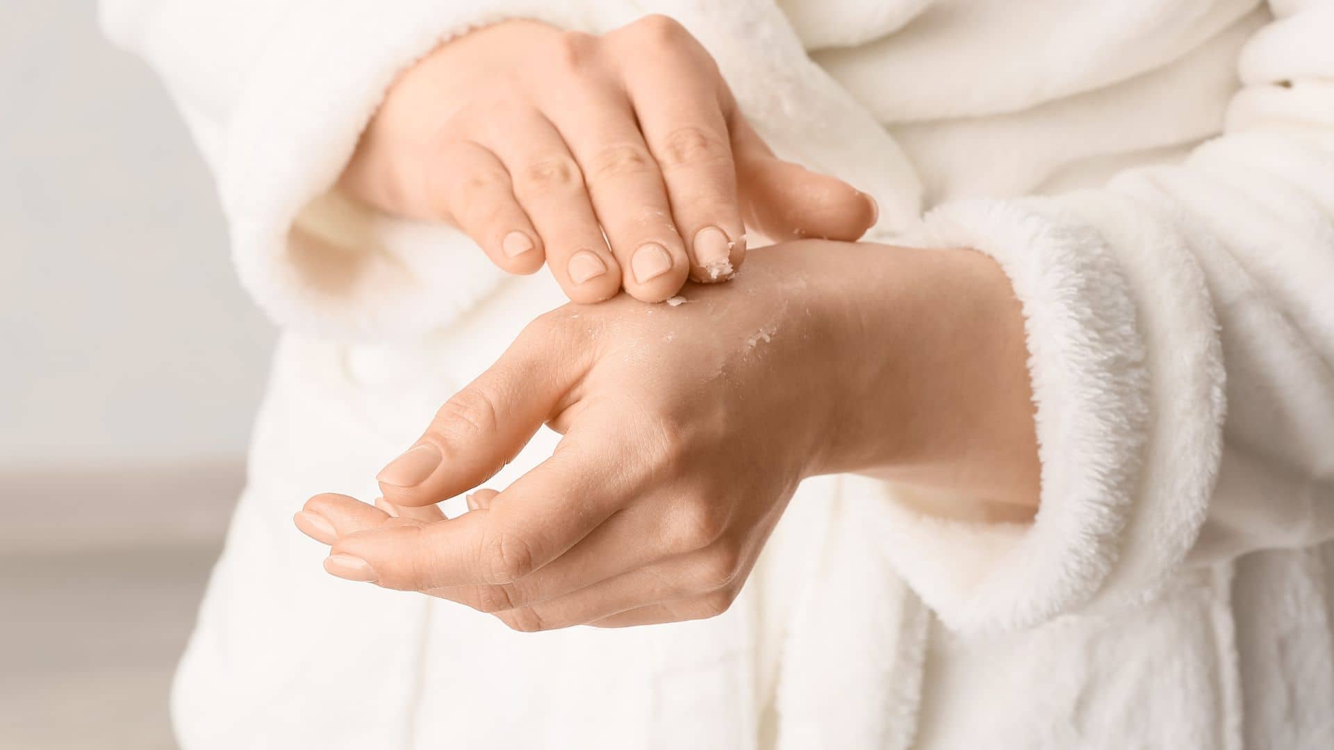 woman applying shea butter