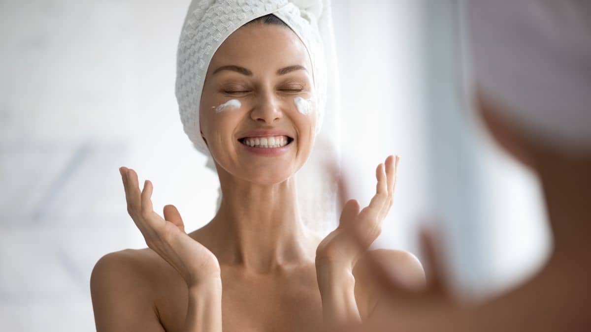 woman applying eye cream