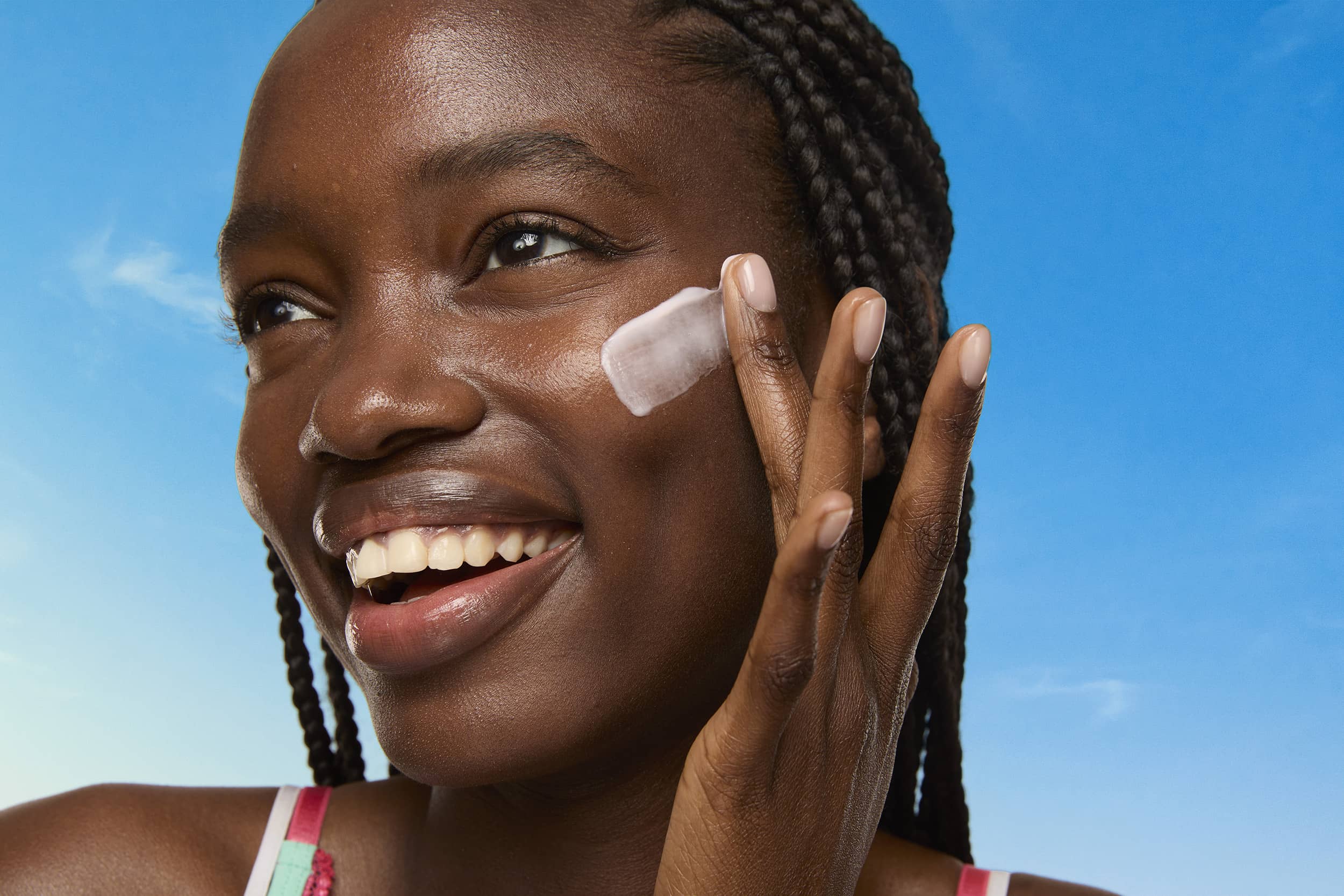 woman applying french indigo extract skincare nine-to-five