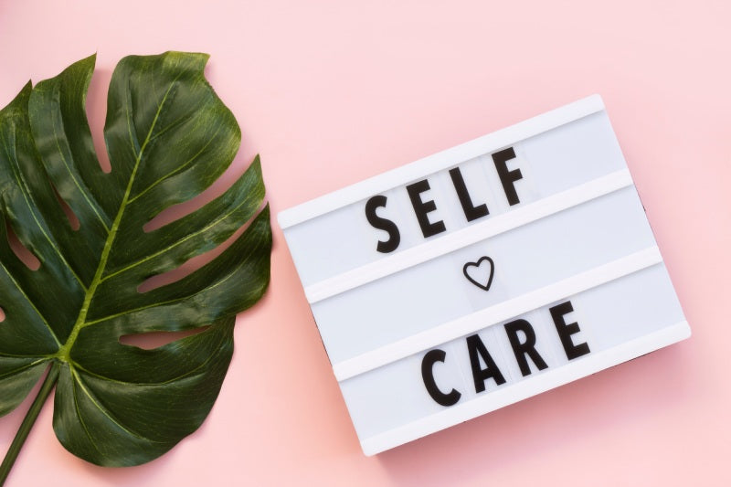 Self care sign on pink background