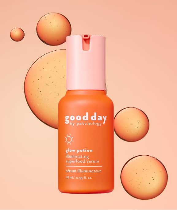 glow potion brightening serum on a bright orange background