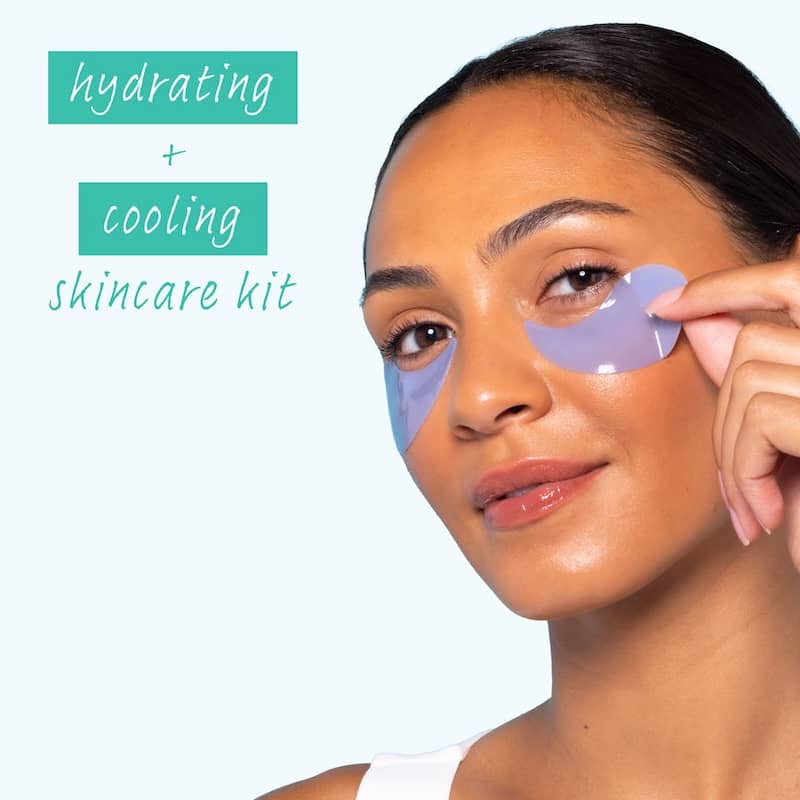 Smiling woman pressing blue gel patches under her eyes, with text reading hydrating and cooling skincare kit on a pale blue background