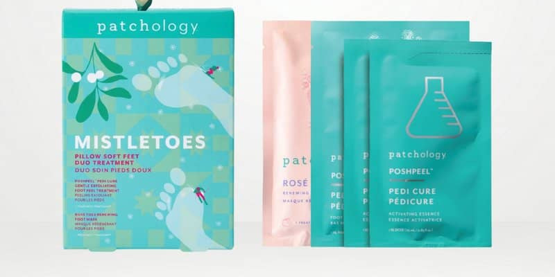 Foot treatment set with a teal box, a pink packet, and two teal pouches on a clean white background.