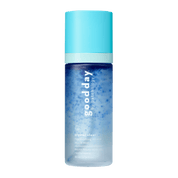 A bottle of Good Day Crystal Clear Refreshing Mineral Micra Mist, featuring a light blue cap and a blue-to-clear gradient bottle, centered on a solid green background.
