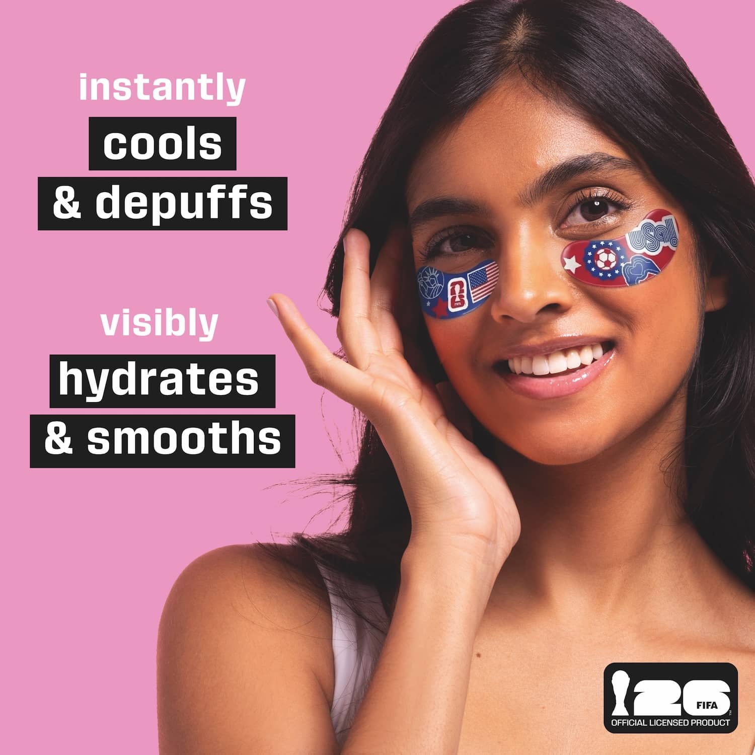 Woman with patriotic fifa world cup eye patches on a pink background with text about product benefits. Instantly cools and depuffs. Visibly hydrates and smooths.