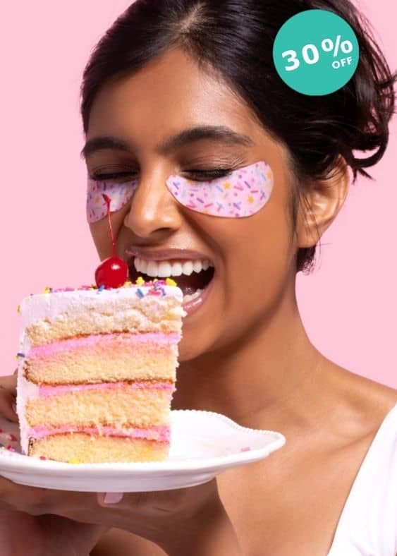 A close-up of a woman with closed eyes wearing eye want cake birthday under-eye patches, with a pink circular '30% OFF' sale badge in the top right corner against a teal background.