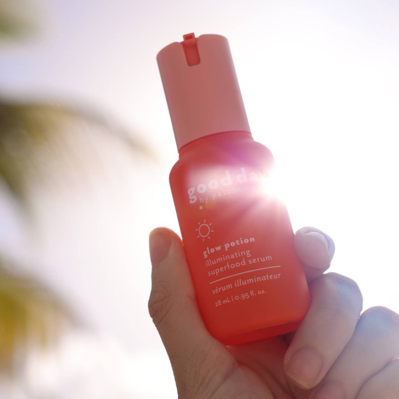 bright sky hands holding a serum skincare