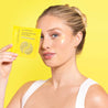 woman using illuminating undereye patches eye mask for dark circles