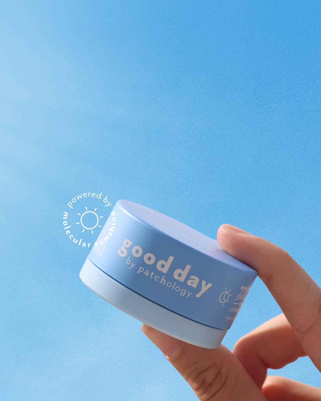 good day eye pillow depuffing under-eyes smoothing eye cream on a bright blue background