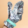 Close up woman wearing self-warming moisturizing gloves