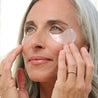 brightening under eye mask woman wearing rejuvenating caffeine depuffing under eye masks