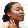 woman wearing restoring night patchology eye gels with retinol and peptides