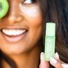 Woman wearing roll model brightening eye serum