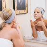Woman wearing the Hydrate facial sheet mask at home spa day