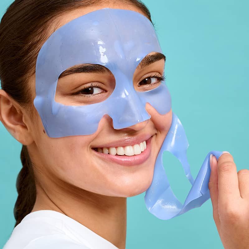 in use woman wearing hydrogel on ice face mask to firm and depuff skin
