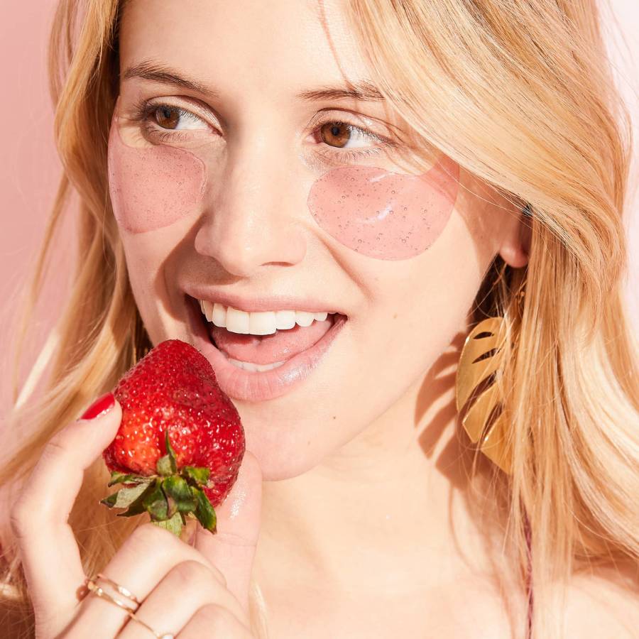 woman wearing rosé eye gels to renew and brighten skin