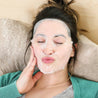 woman with brown hair wearing the perfect weekend facial sheet mask